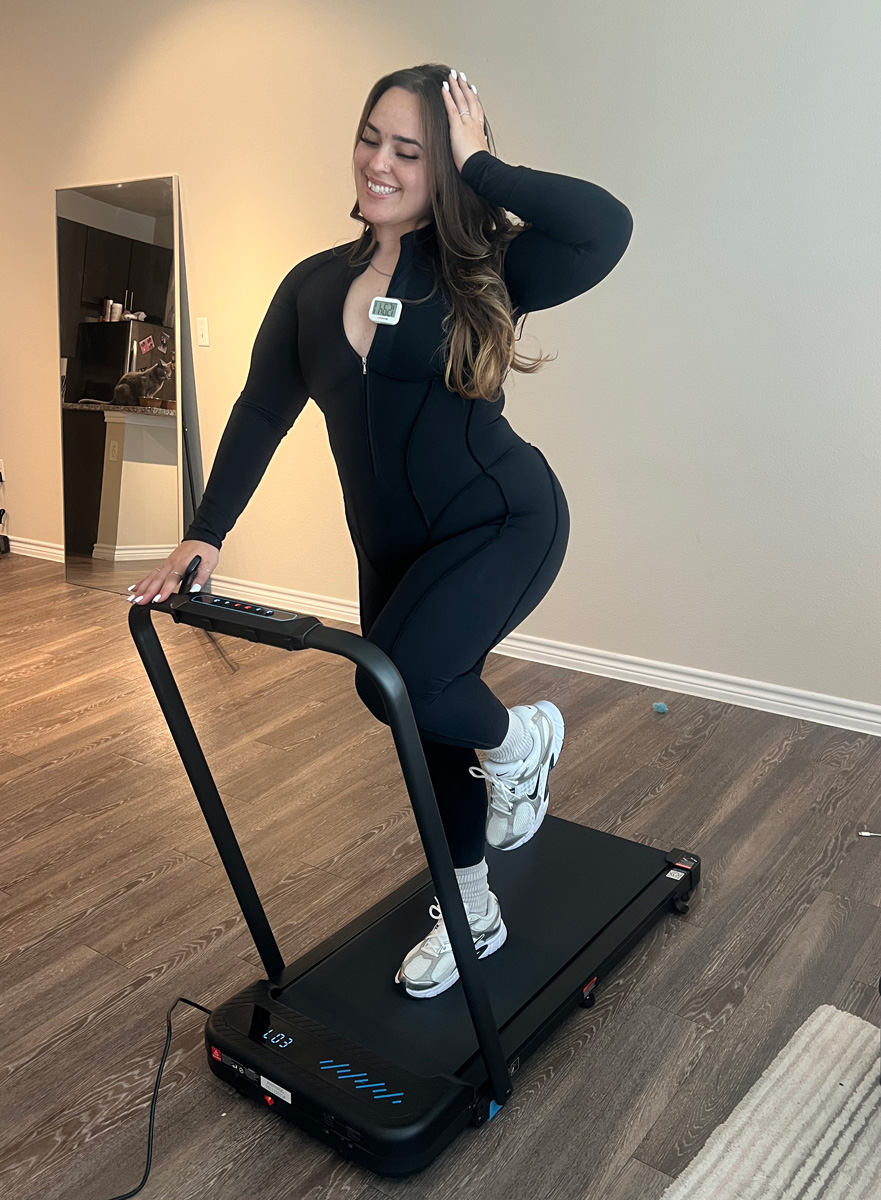 Coach is walking in a treadmill.
